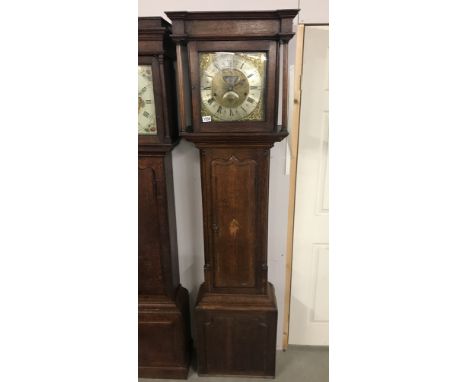 An inlaid oak cased 8 day long case clock, brass moonphase with silvered dial, 'Wm Lister, Keighley'.