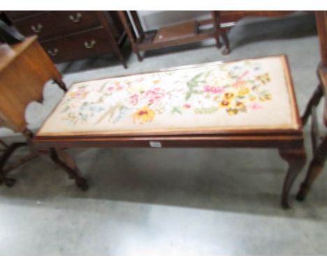 A duet stool with tapestry seat.