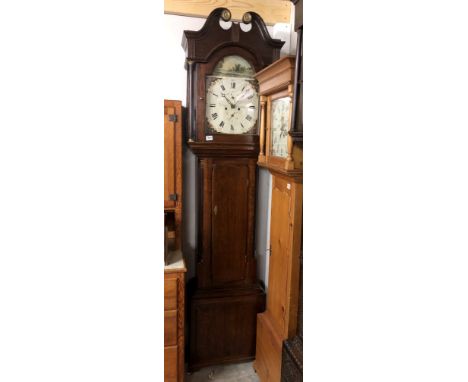 An 8 day long case clock with painted dial 'R.Dunne, Bradford'.