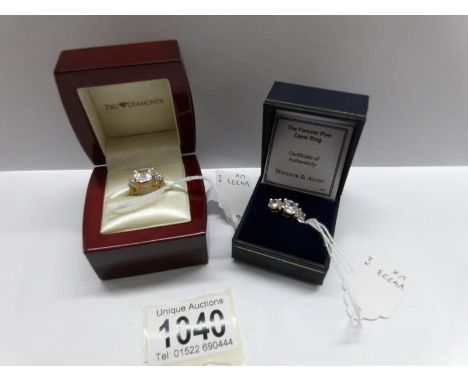 A cushion cubic zirconia gold plated dress ring (size K half) and a cubic zirconia trilogy ring in gold plated shank (size K 