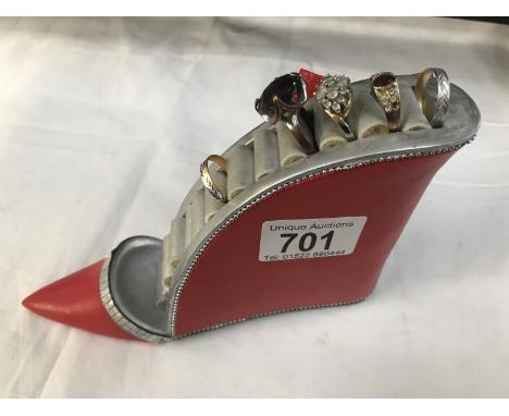 A ring 'shoe' with 5 dress rings.