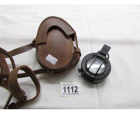 A T.G &amp; Co., 1044 Mk III military compass with original leather case.