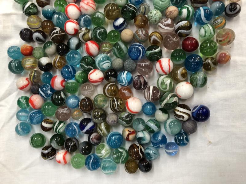 A box of various marbles.