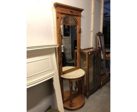 A mahogany hall stand with marble shelf.