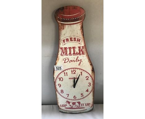 A metal milk bottle advertising sign wall clock.