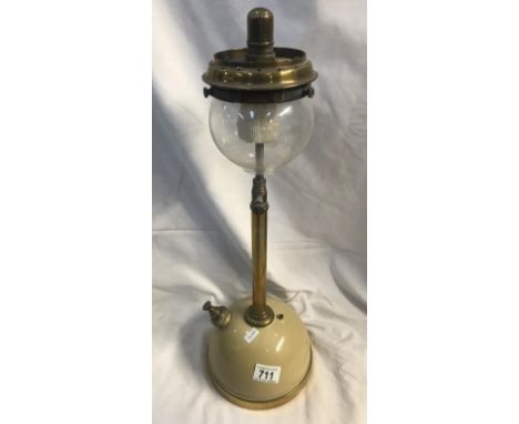 A tilly table pressure lamp with onion shade.