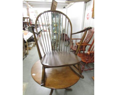 A dark Ercol rocking chair.