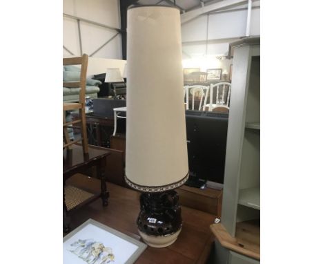 A large 1970s pottery table lamp with tall shade.