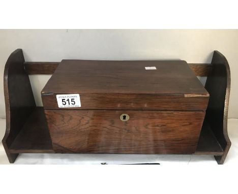 A wooden tea caddy (unlined) and a wooden bookshelf.