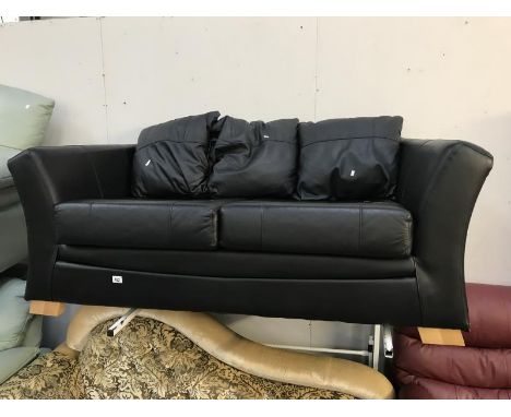 A black leather 2/3 seater sofa.