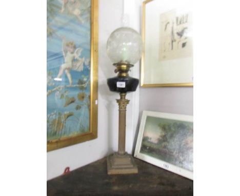 A brass Corinthian column oil lamp with glass font and acid etched shade.