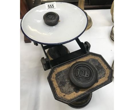 A set of scales marked W S Barrett &amp; Son Boston with 2 weights.