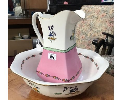 An oriental style jug and basin set.