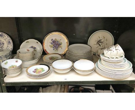 A shelf of czechoslovakian dinner ware.