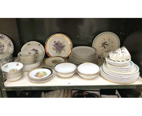 A shelf of czechoslovakian dinner ware.