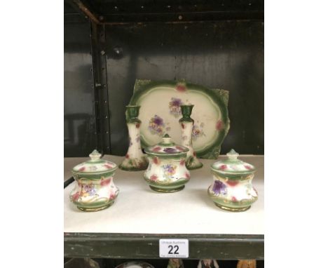 A Staffordshire pottery trinket set.