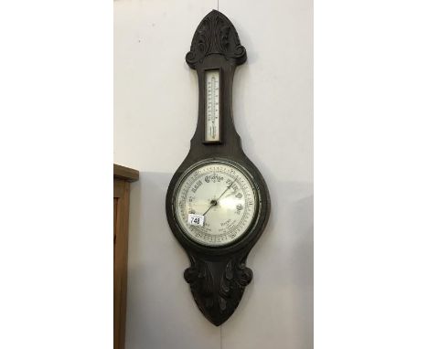 An Edwardian oak barometer with silvered dial glass a/f.
