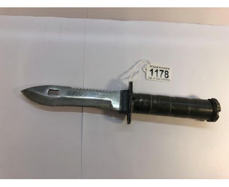 A survivor knife with compass hidden in butt.