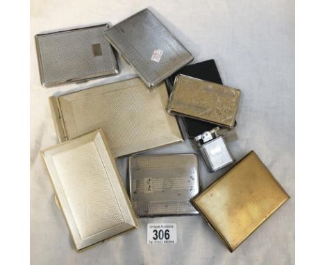 A box of cigarette cases and a cigarette lighter.