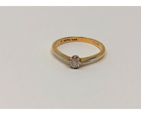 An 18ct gold platinum set diamond solitaire ring, size K/L, 2.2g.