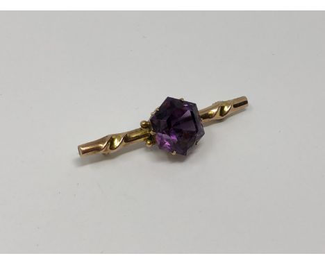A gold amethyst brooch