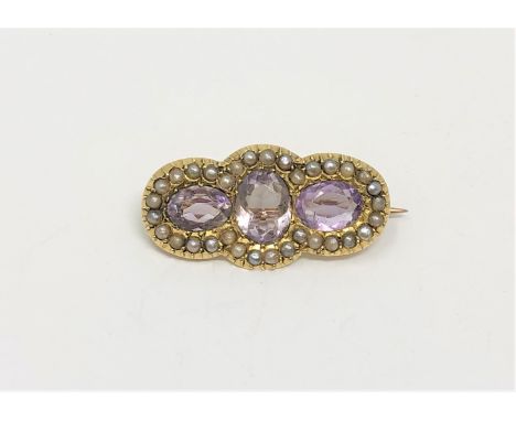 An antique 15ct gold amethyst and pearl brooch, 5.3g.