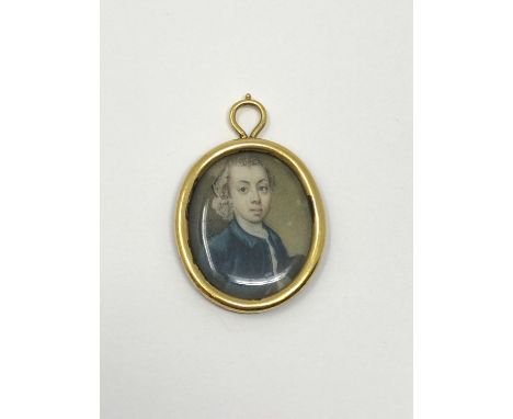 An early 18th century portrait miniature in high carat gold frame