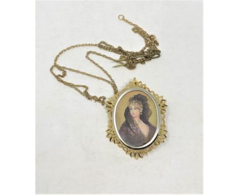 A hand finished portrait miniature pendant mounted in two tone metal with 18ct gold bale, 23 mm x 34 mm.