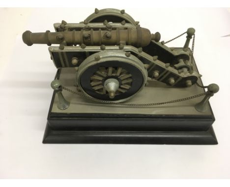 A composite model of an old canon on wooden base.Approx 15x22cm