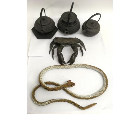 A well detailed bronzed model of a crab, three Chinese iron teapot and odds