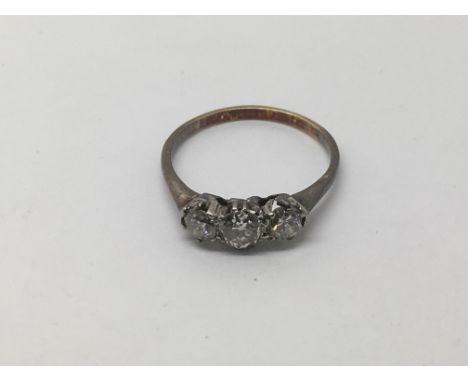 A three stone diamond ring, approx 1.6g and approx size J.