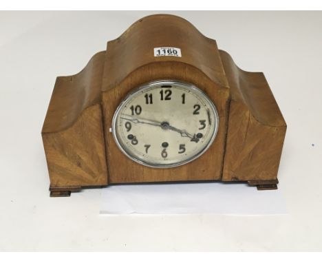 An Art Deco design walnut mantel clock.