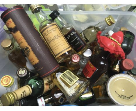 A collection of miniature bottles of single malt scotch and other liquors.