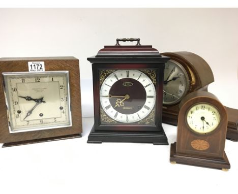 Four mantel clocks including a small Edwardian clock an oak cased mantel clock retailed by Goldsmiths (4) 