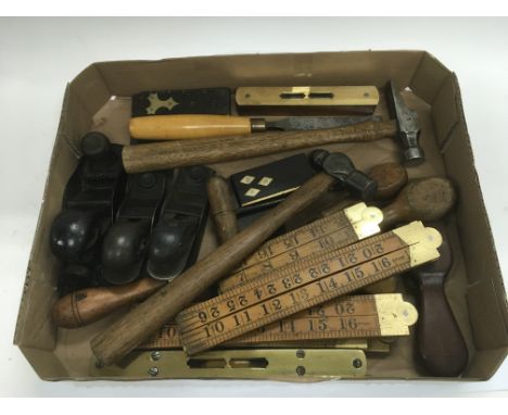 A collection of various woodworking tools including wood planes, spirit levels etc.