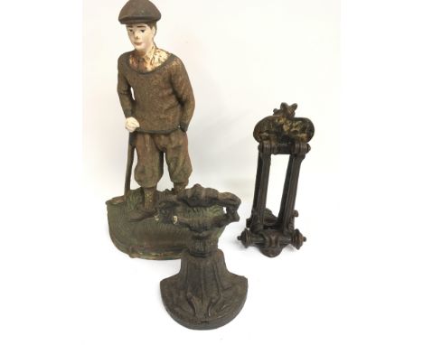 A Victorian cast iron door knocker letterbox with embossed bat motif by Kendrick and Sons, plus a Victorian and golfer doorst