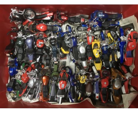 A collection of model mega bikes and stands together with associated magazine type files in binders.