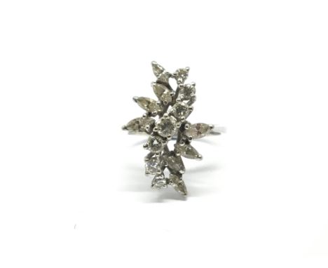 A ladies unmarked white metal and diamond cocktail ring. Total weight approx 4 grams, ring size J.