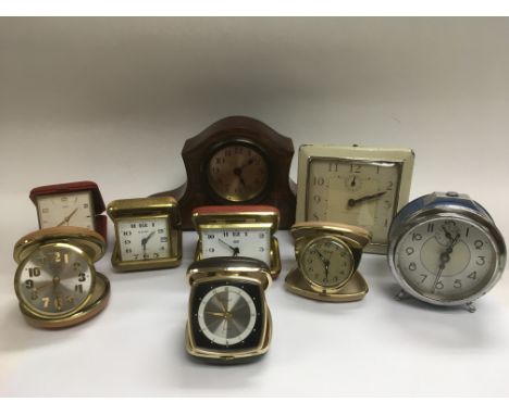 Eight vintage alarm clocks and an inlaid mantle clock (9).