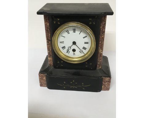 A Victorian black slate and marble mantel clock