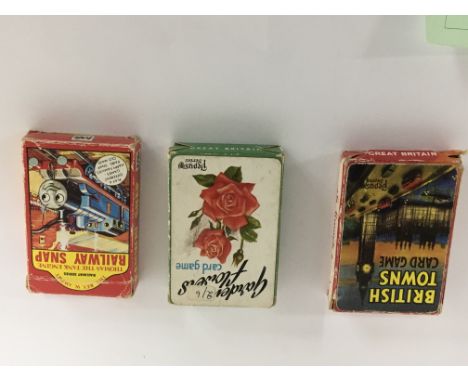 A collection of three packs of vintage playing cards Railway Snap, British Towns card game and Garden Flowers. (3)