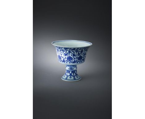 A Chinese blue and white stem cup, Qianlong, supported on a splayed hollow stem foot angled to the cup with steep sides risin