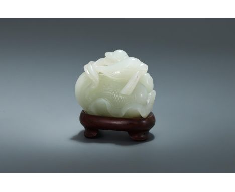 A Chinese white jade 'Mandarin ducks and lotus' group, 18th century, the stone deftly carved into the form of a pair of Manda