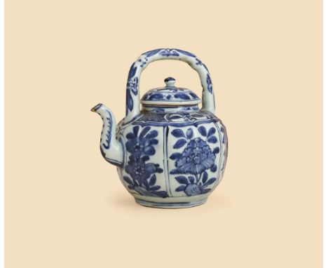 A Chinese blue and white wine pot and cover, Wanli (1573-1619), of lobed globular form with overhead arched handle and serpen