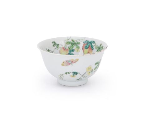 A Chinese Famille Rose 'Melon and butterfly' bowl, Qianlong seal mark and of the period, the deep round sides rising from a s