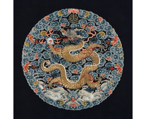 A good Imperial Chinese 'dragon' roundel, Qing dynasty, circa 1800, depicting an Imperial profile dragon made for either a fi
