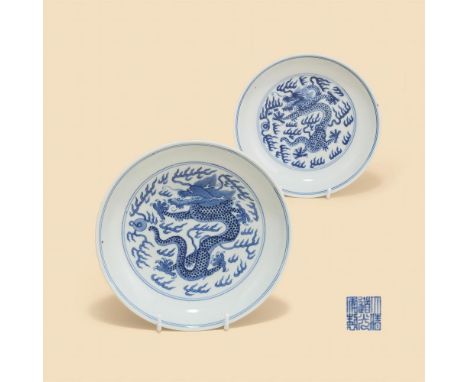 Two similar Chinese blue and white 'dragon' dishes, Daoguang mark and of the period (1820-1850), each with a five-claw dragon