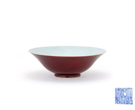 A Chinese copper-red bowl, Qianlong mark and of the period, of flared form with slightly everted rim, the exterior glazed in 