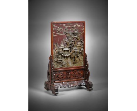 A Chinese Qiyang soapstone 'landscape' table screen, late Qing dynasty, 19th century, the rectangular panel well carved on on