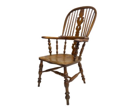 Elm and beech high back Windsor chair,  high hoop back with pierced splat and spindle supports over shaped saddle seat, raise